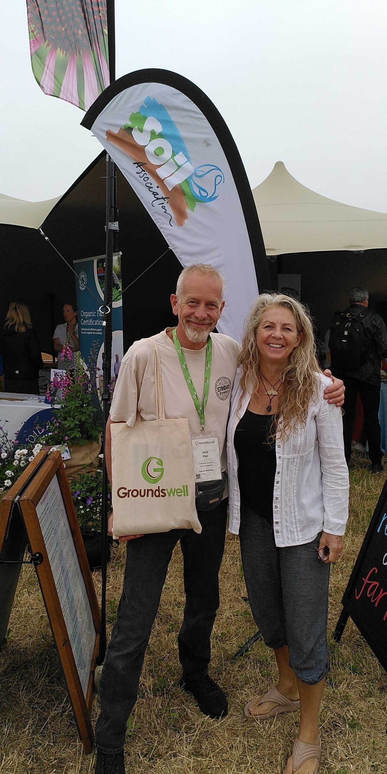 Members of the Procurement for Good project team standing in Cultivate's project garden, being given a tour by the manager Richard.